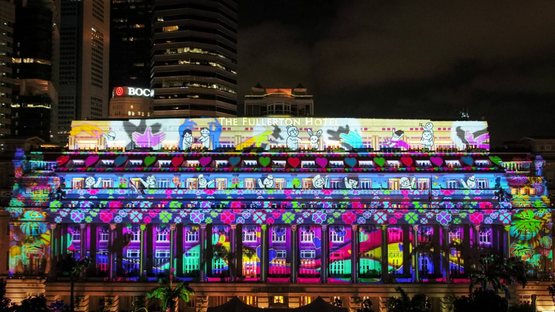 The Fullerton Hotel Singapore's majestic facade has been turned into an illuminated canvas to tell of our unwavering Singapore Spirit in 2021.
