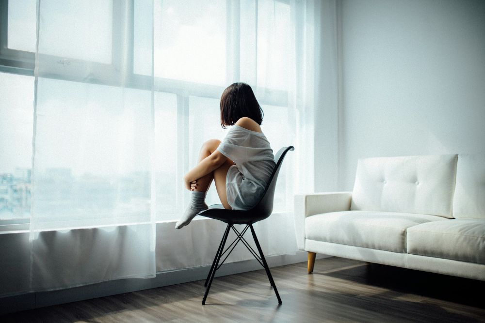 Woman looking out a window
