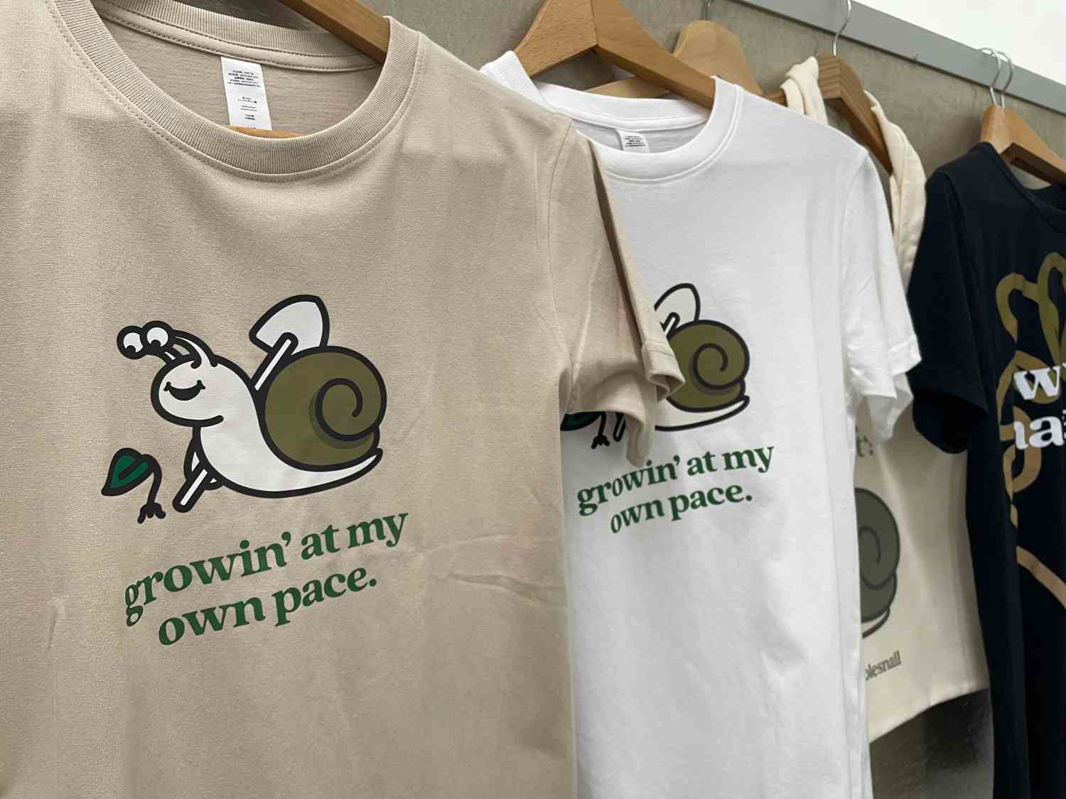 Wearable WholeSnail merchandise with life lessons.