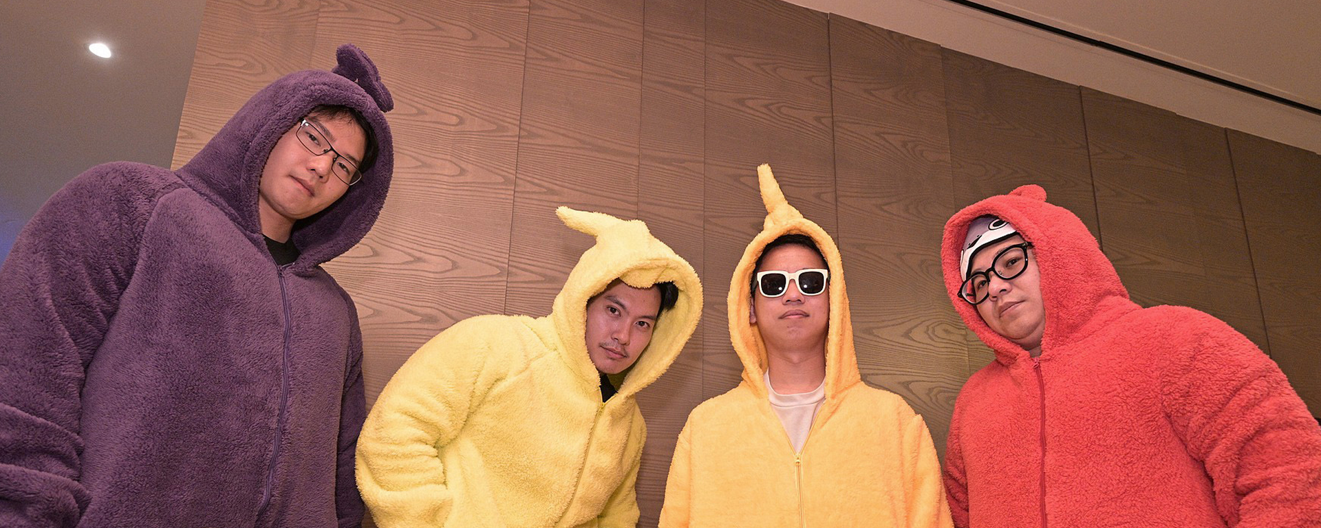 A group of 4 people wearing Teletubbies character-themed costumes at a So Drama Entertainment event.