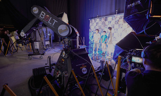 Virtual production studio featuring high-speed robotic camera technology and advanced lighting.