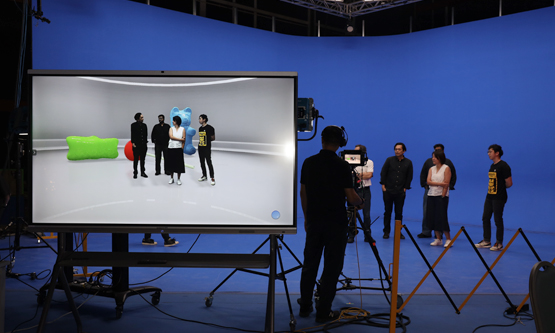 Professional video production in a state-of-the-art studio featuring a green screen.